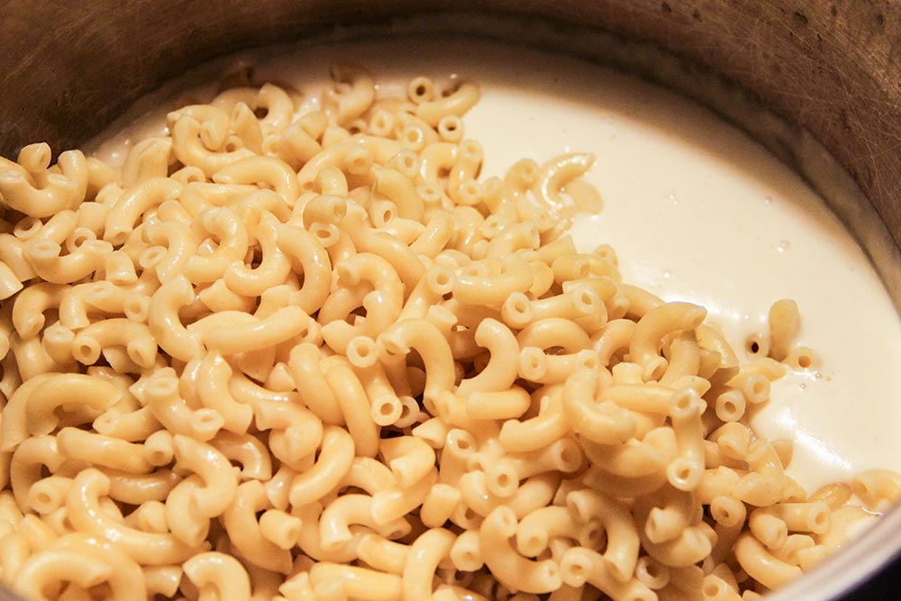 Adding Pasta To Cheese and Milk Mixture