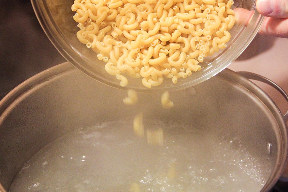 Dumping Pasta Into Boiling Water