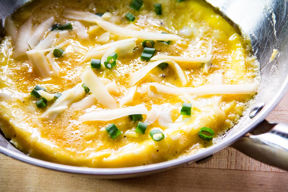 Adding Scallions and Swiss Cheese to French Omelet