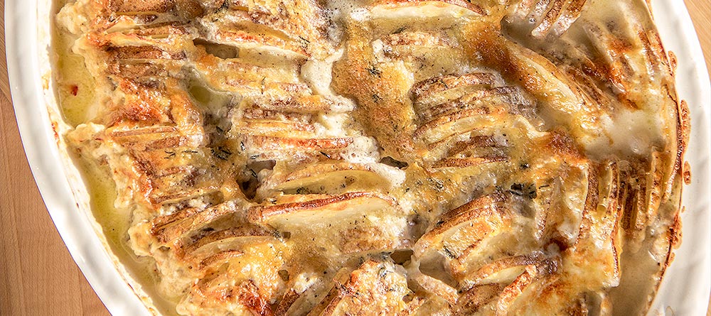 Extra Cheesy Garlic Hasselback Potato Gratin