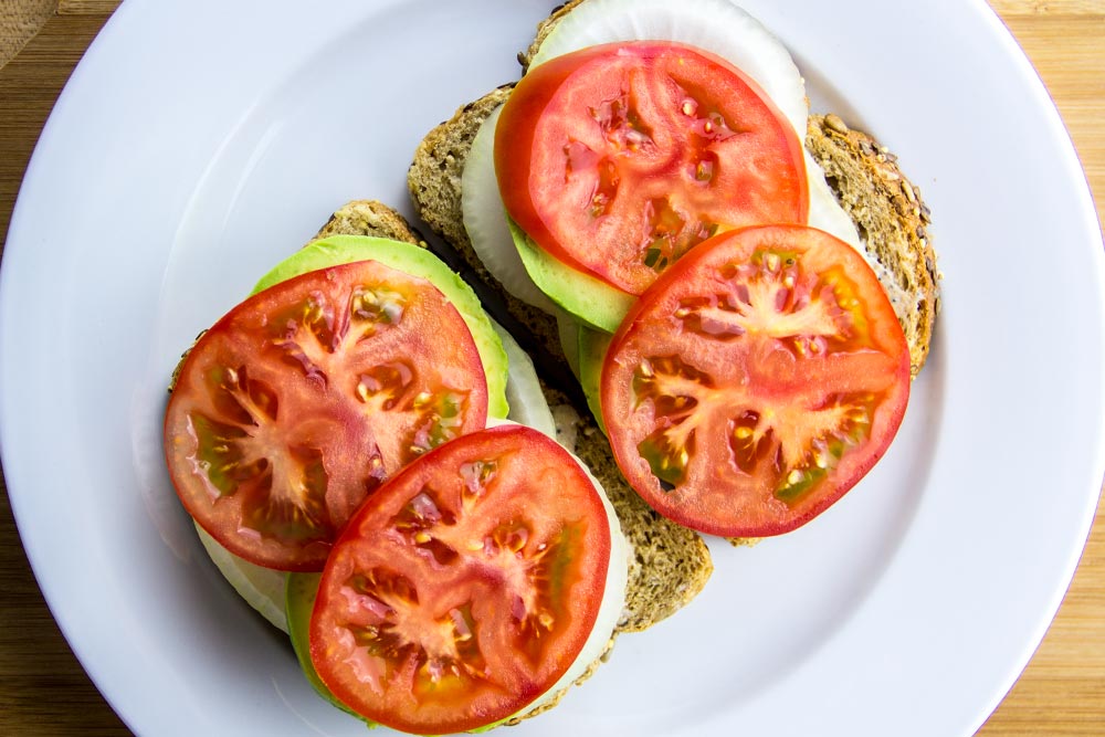 Adding Tomato Slices to Sandwich