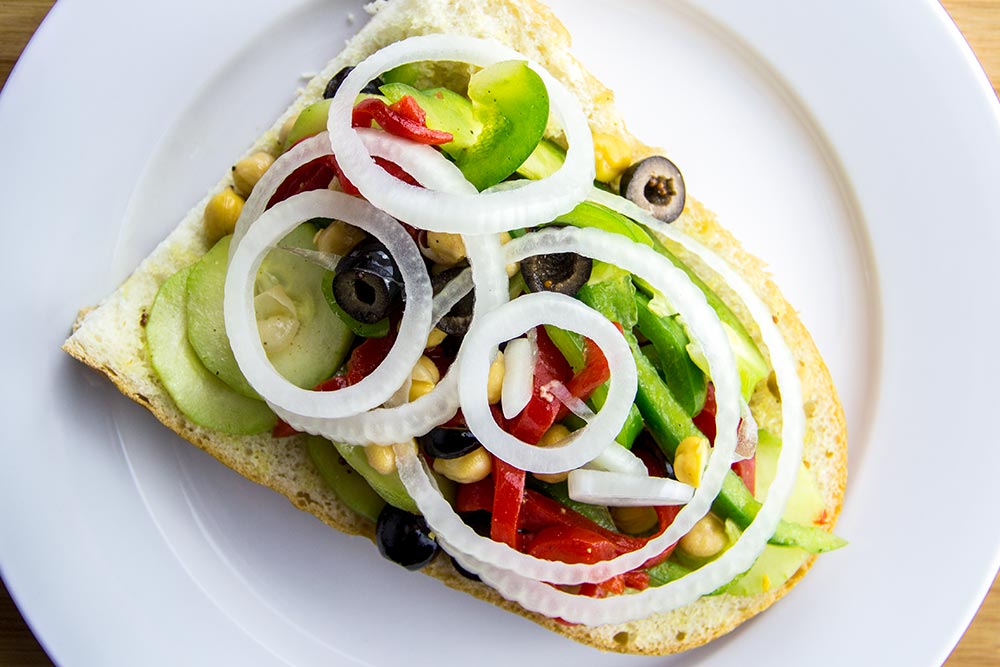 Adding Onion Slices to Sandwich