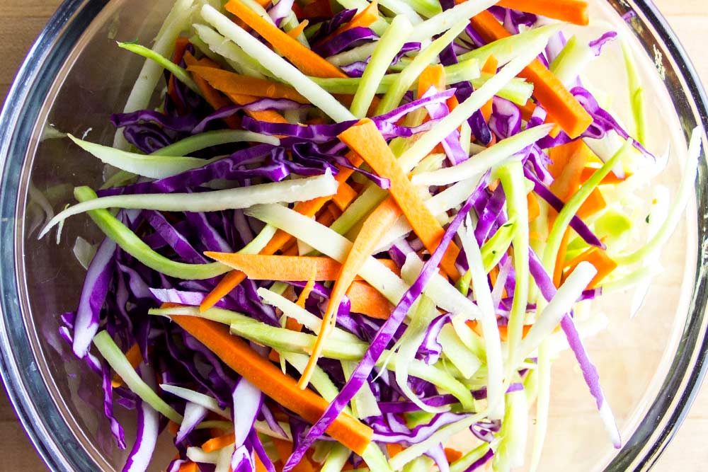 Homemade Broccoli, Carrot & Red Cabbage Slaw in a Glass Bowl