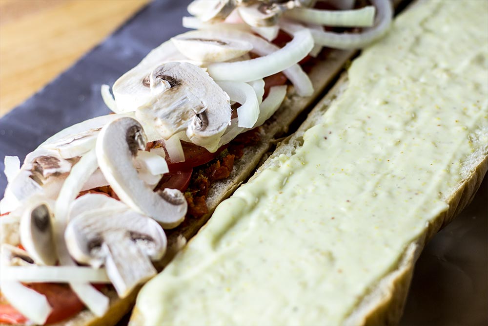 Adding Mushrooms to Sandwich