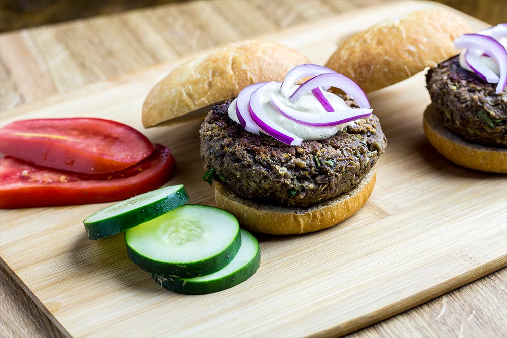 Assembling Veggie Burgers on Cutting Board