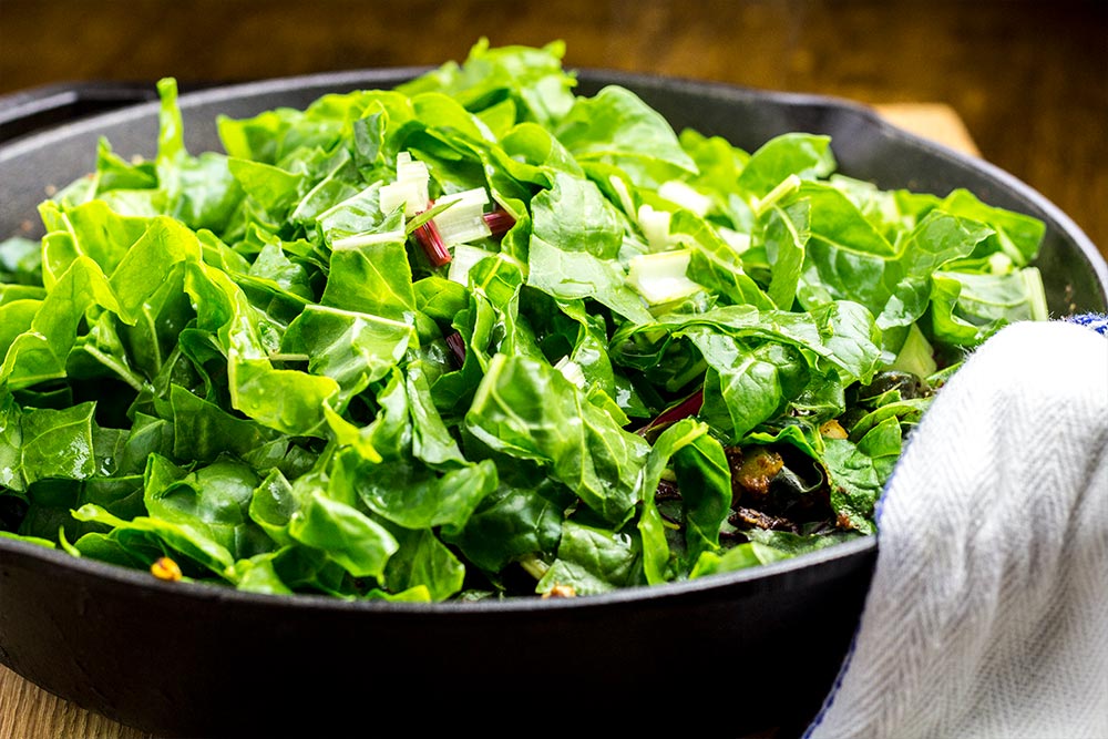 Cooking Down Swiss Chard in Lodge Cast Iron Skillet