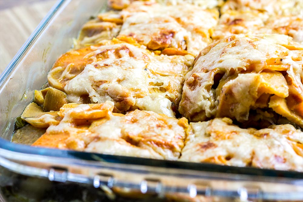 Removing Piece of Sweet Potato Gratin from Casserole Dish