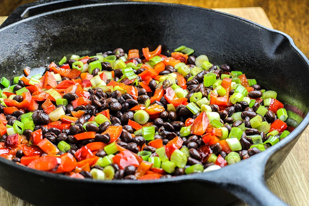 Red Bell Pepper, Black Beans & Sliced Scallion in Cast Iron Skillet