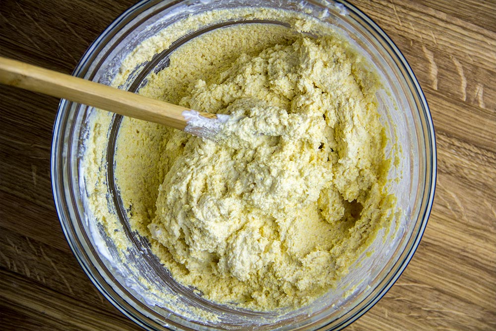 Mixing Cornmeal Mix in Glass Bowl