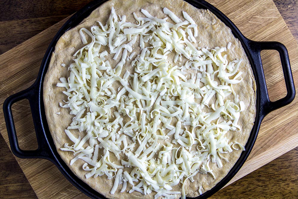 Shredded Mozzarella on Pizza Dough