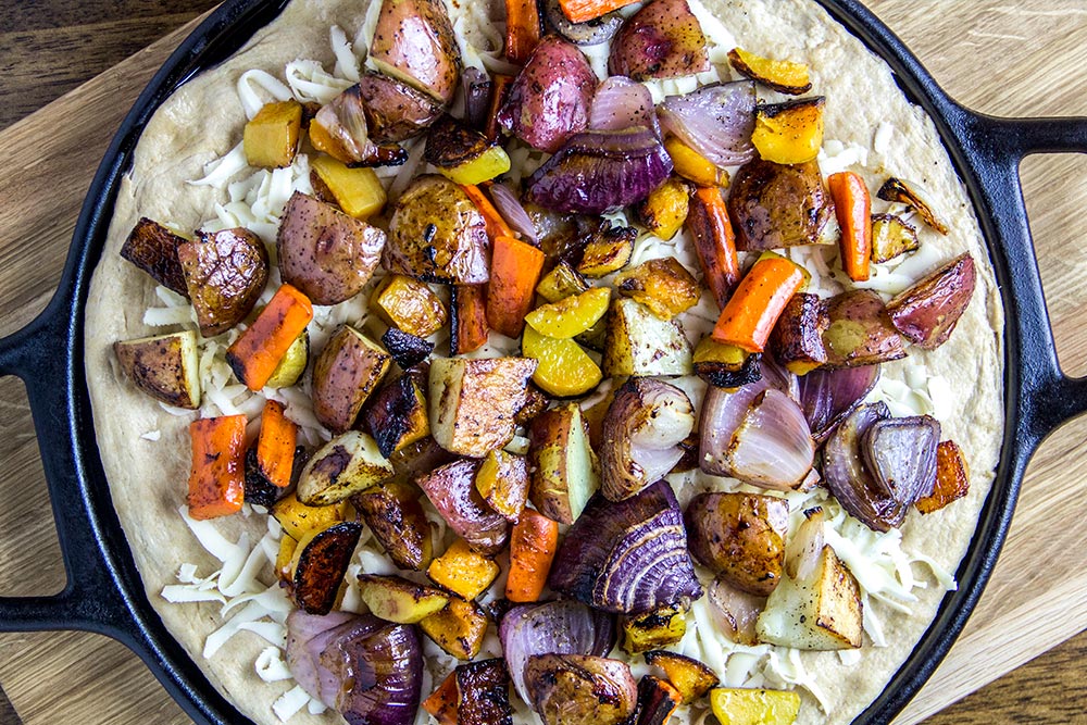 Spreading Vegetables on Pizza Dough