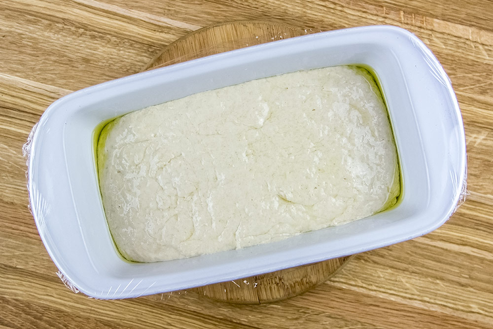 Dough in Bread Pan Covered with Plastic Wrap