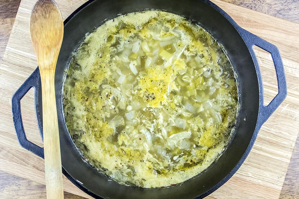 Simmering Seafood Stew Liquids in Cast Iron Dutch Oven