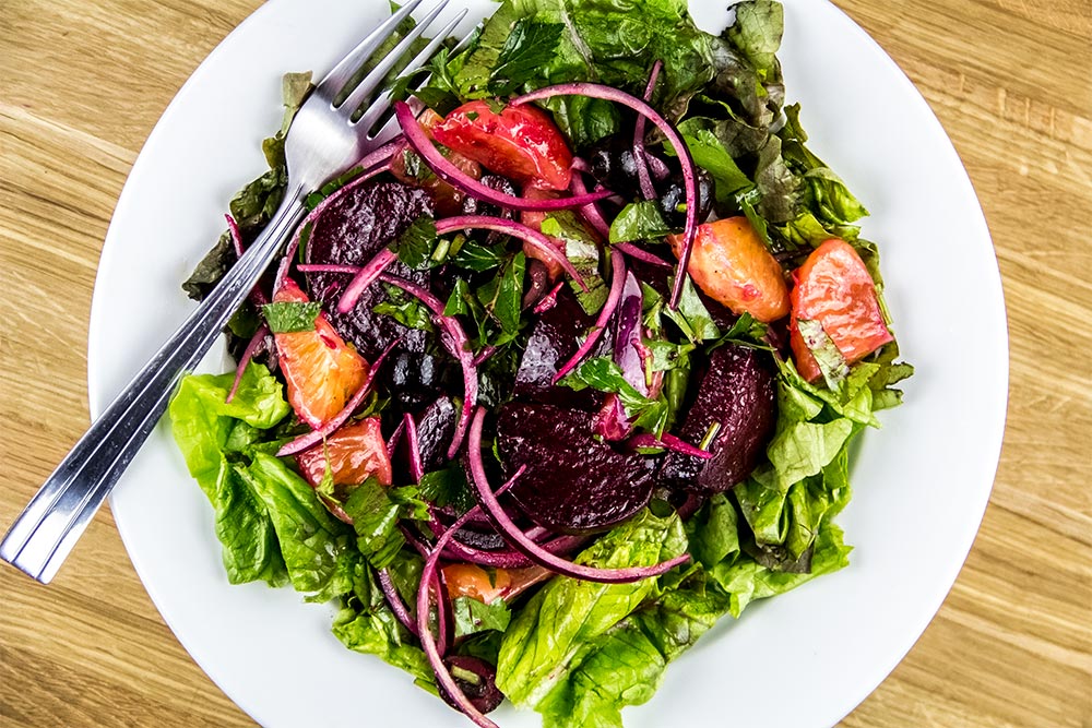 Warm Beets, Oranges and Black Olives Salad on Plate