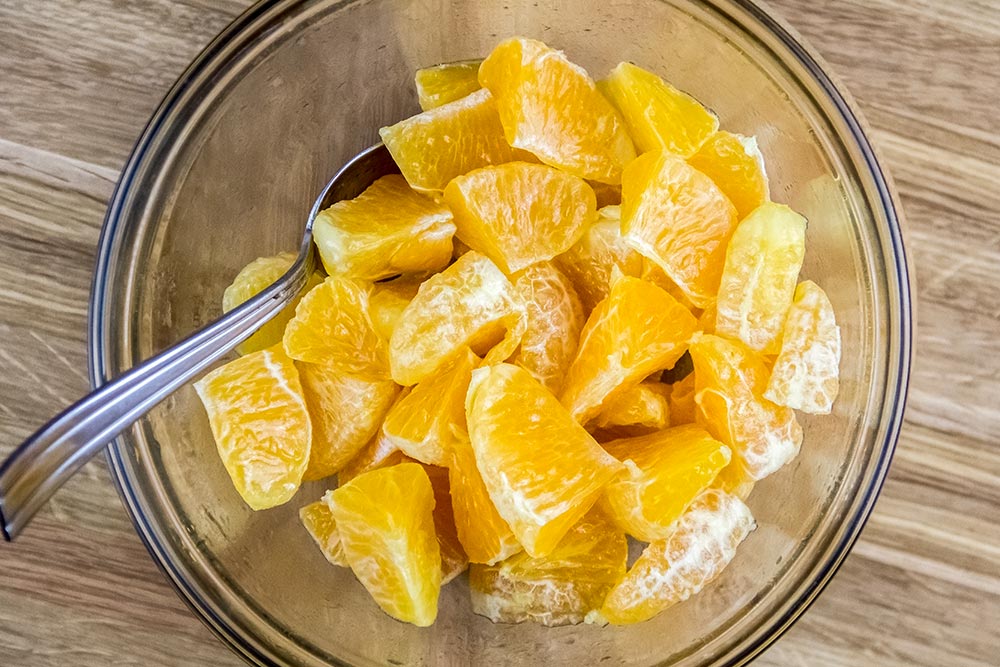 Orange Pieces in Glass Bowl