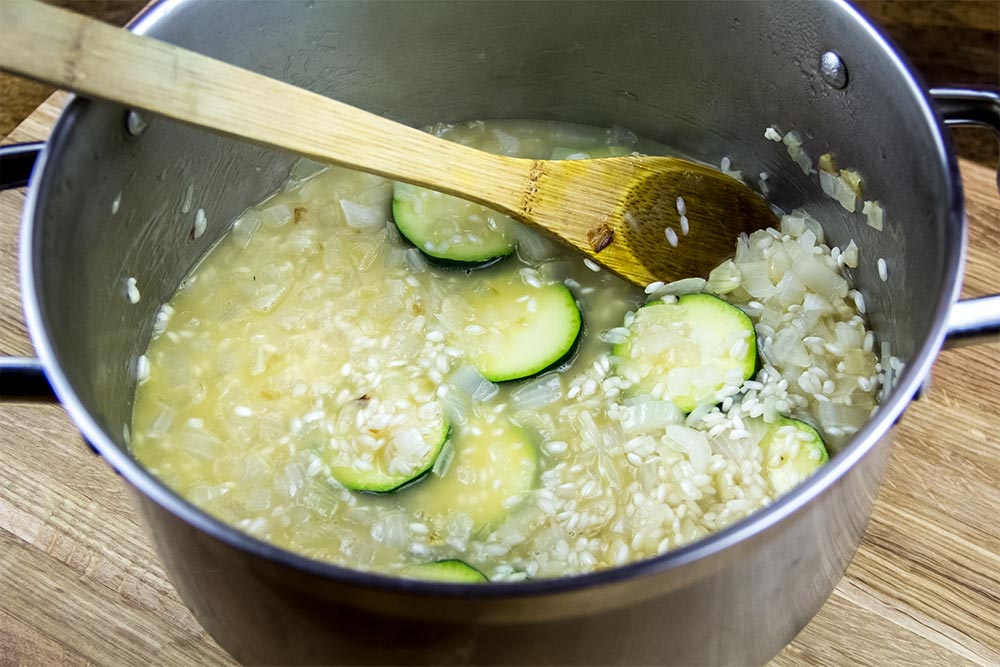 Adding Zucchini to Risotto in Saucepan