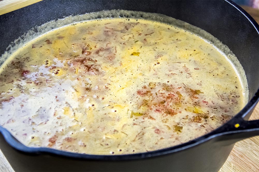 Adding Broth and Water to Soup