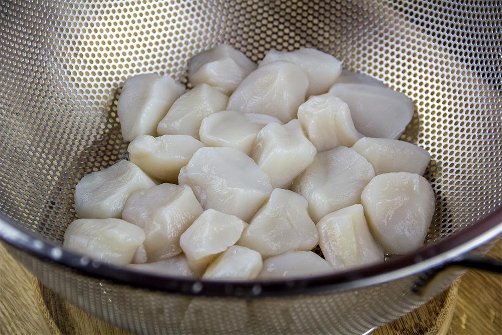 Raw Scallops in Colander