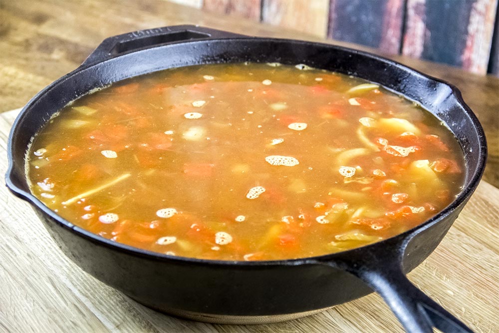 Adding Broth to Rice Mixture