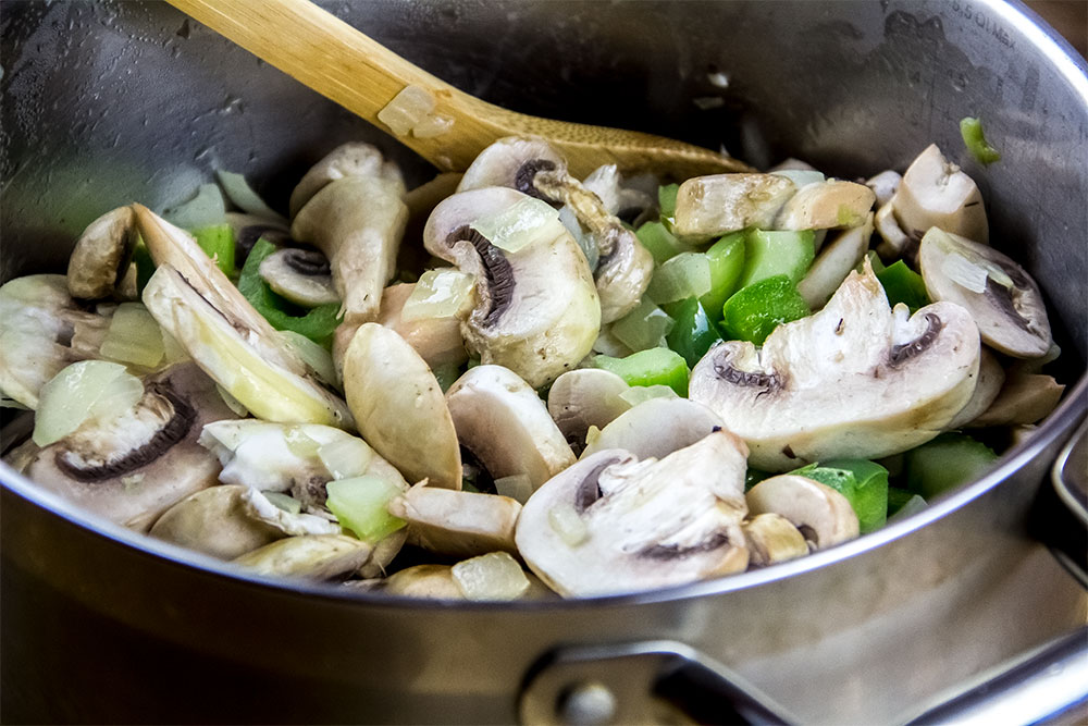 Adding White Button Mushrooms to Pot