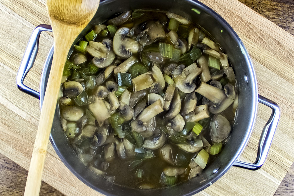 Mushroom Soup Simmering in Broth