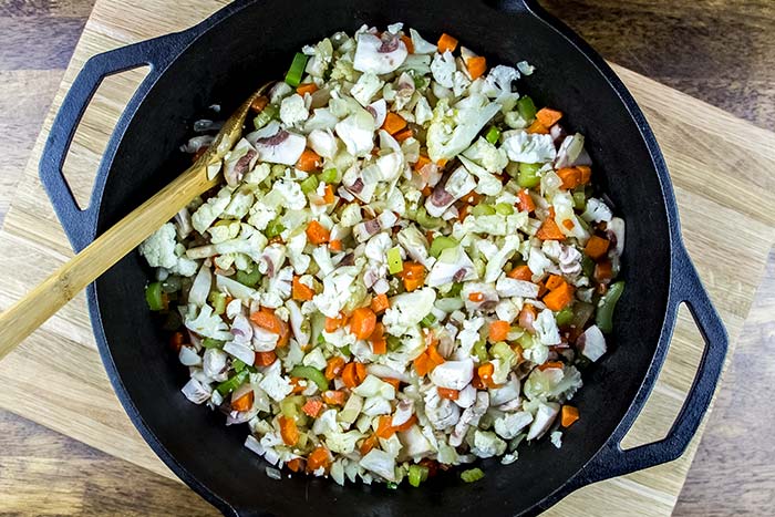 Adding Cauliflower and Mushrooms to Cast Iron Dutch Oven