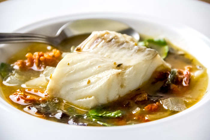 Cod with Sun Dried Tomatos, Greens & Garlic Soup Recipe by June d'Arville