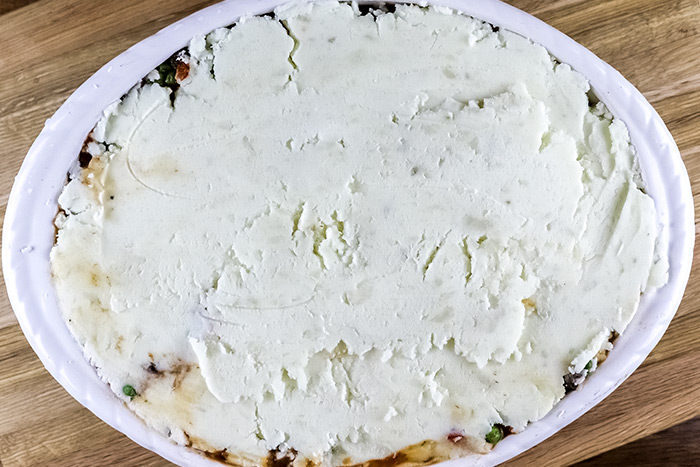 Spreading Mashed Potatoes Over Vegetables