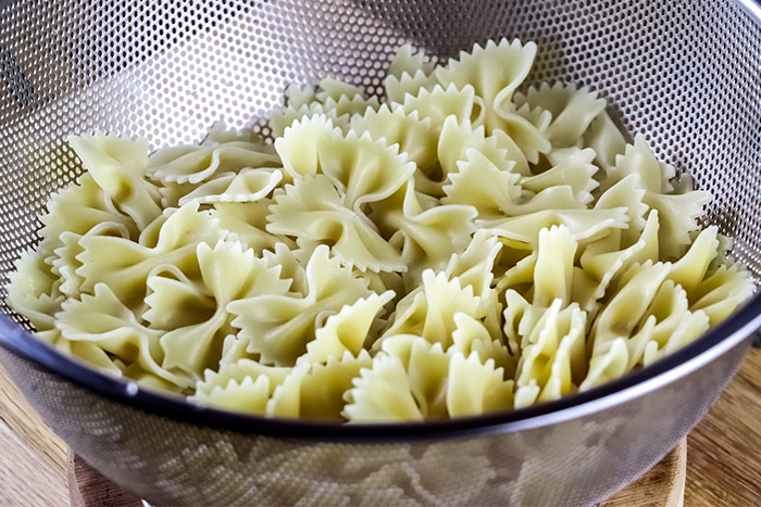 Cooked Farfalle Bowtie Pasta in Colander