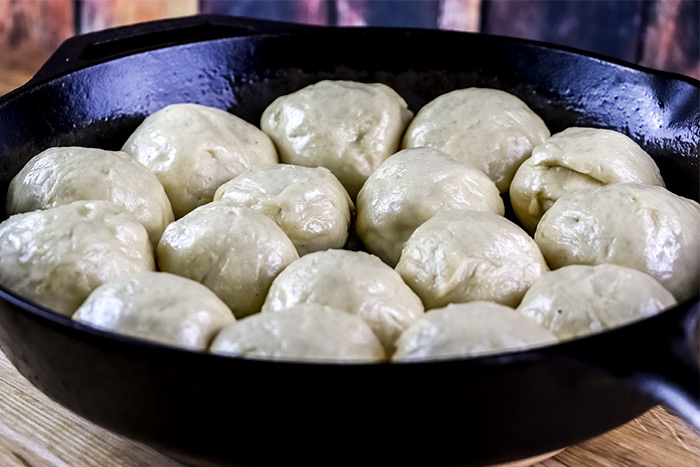Raw Dough Balls in Cast Iron Skillet