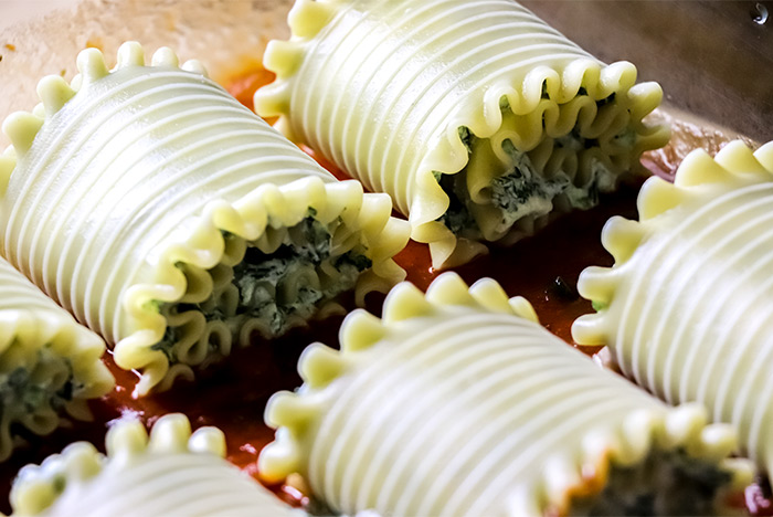 Raw Lasagna Rolls in Casserole