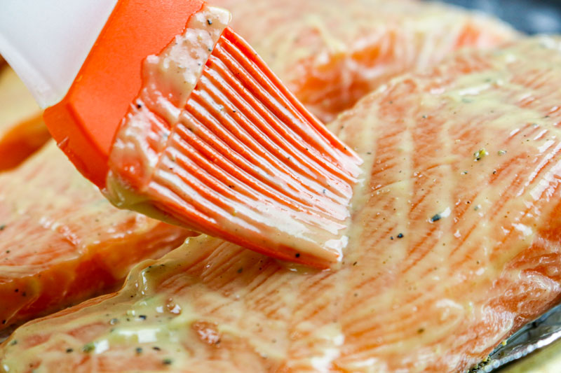 Brushing The Mustard Sauce On Salmon