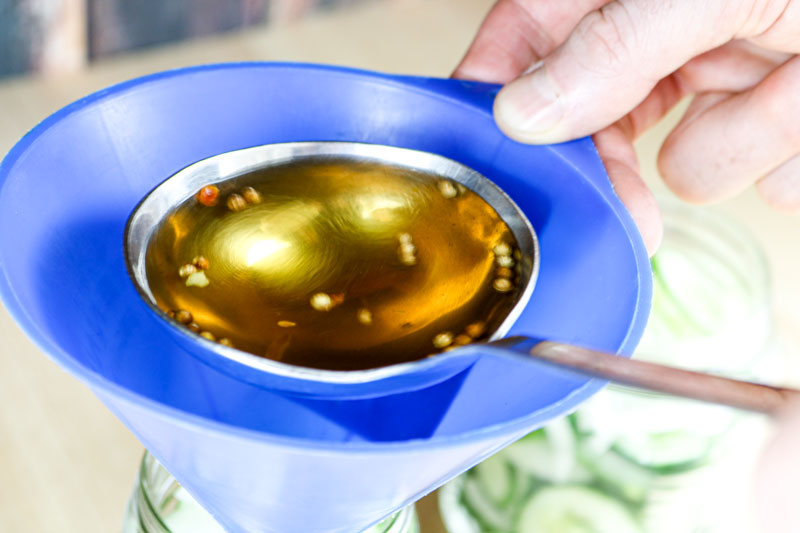 Pouring Brine Into Funnel